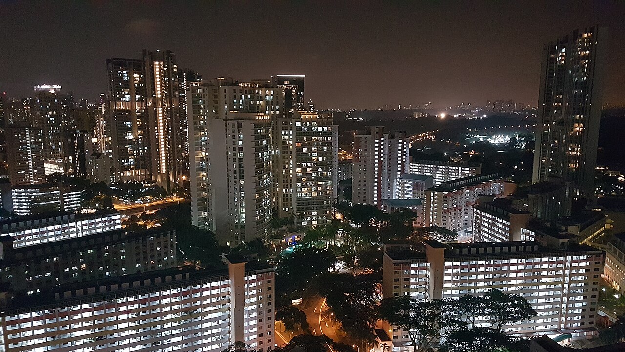 Singapore HDB estate blocks at dusk, photographed from a high floor